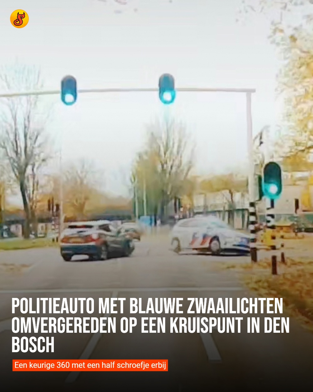 Politieauto met blauwe zwaailichten omvergereden op een kruispunt in Den Bosch