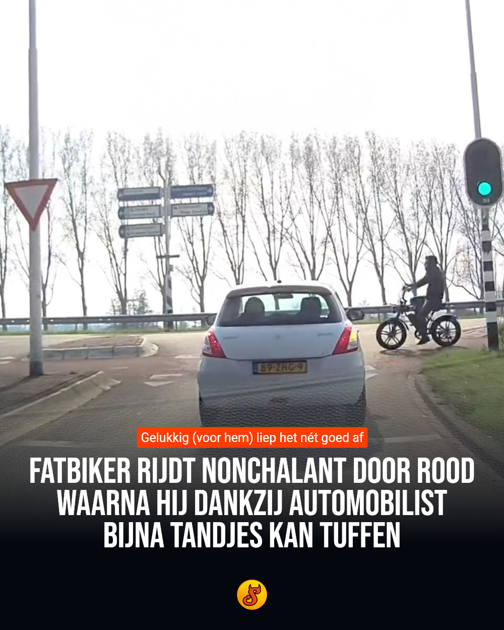 Fatbiker rijdt nonchalant door rood waarna hij dankzij automobilist bijna tandjes kan tuffen