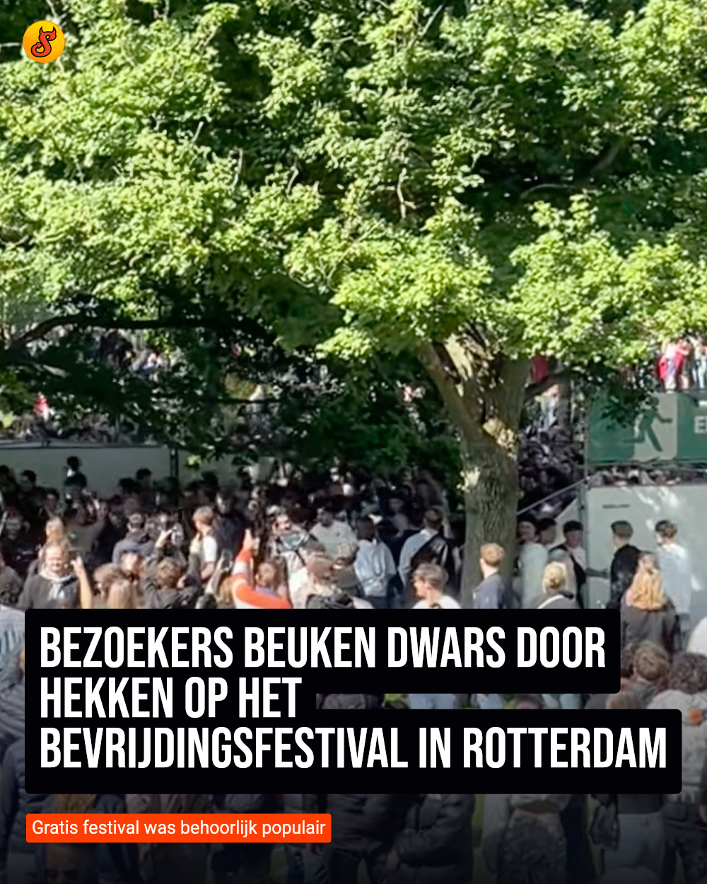 Bezoekers beuken dwars door hekken op het Bevrijdingsfestival in Rotterdam