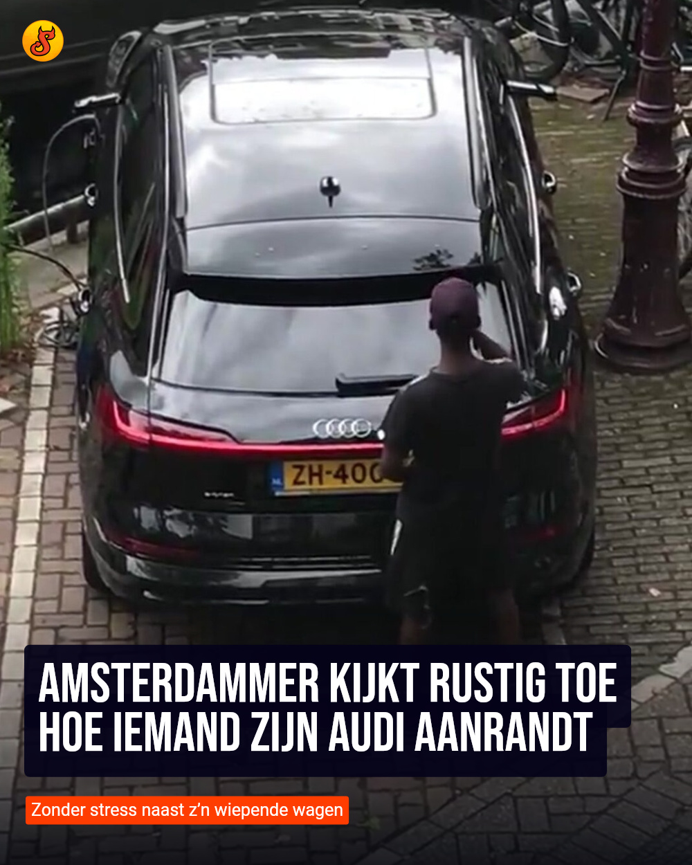 Amsterdammer kijkt rustig toe hoe iemand zijn Audi aanrandt