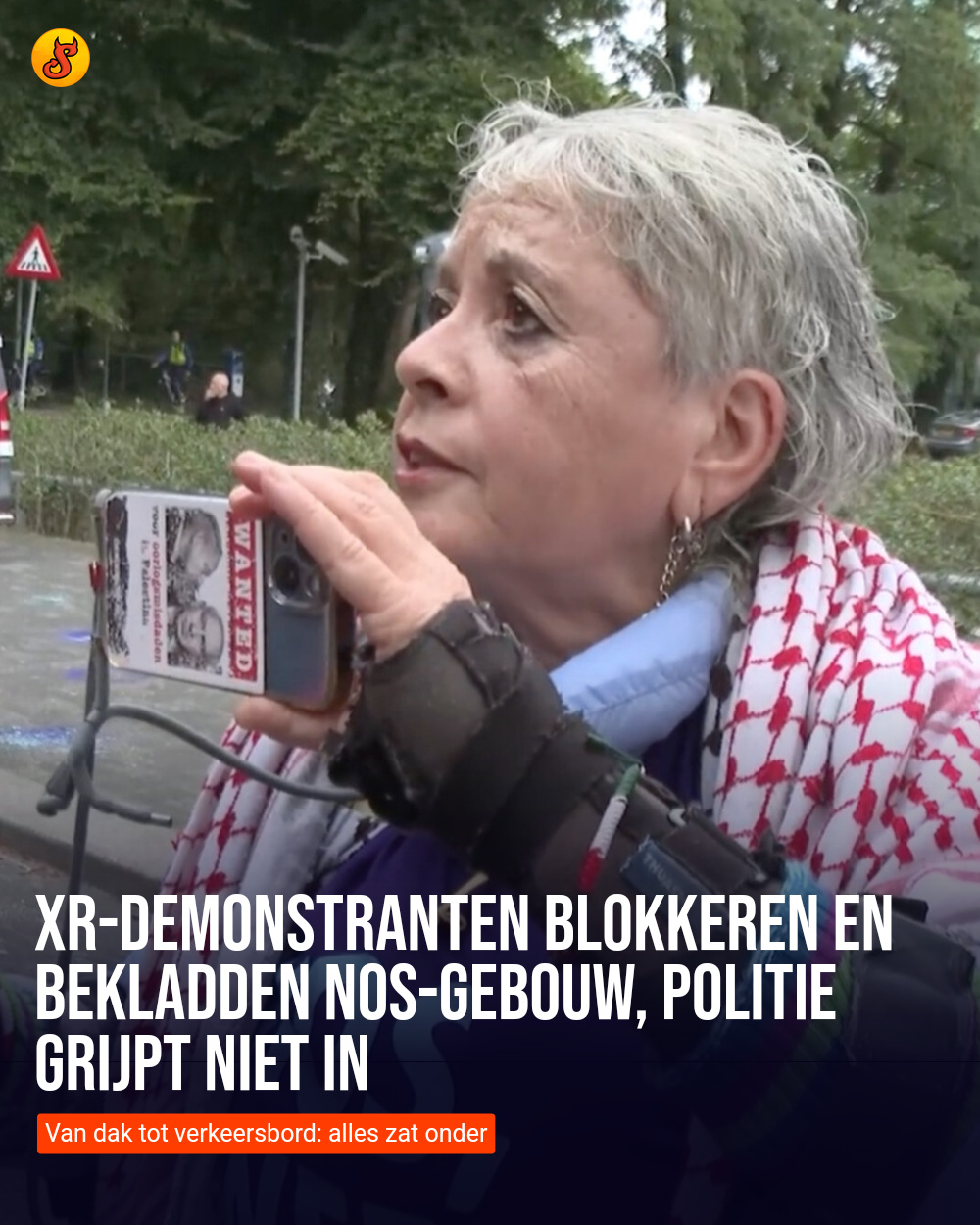 XR-demonstranten blokkeren en bekladden NOS-gebouw, politie grijpt niet in