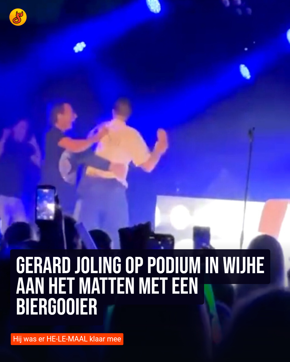 Gerard Joling op podium in Wijhe aan het matten met een biergooier