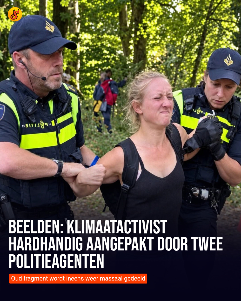 Beelden: Klimaatactivist hardhandig aangepakt door twee politieagenten