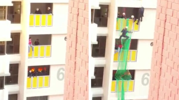 Helden van de dag redden suïcidale man van balkon 6e verdieping in Singapore