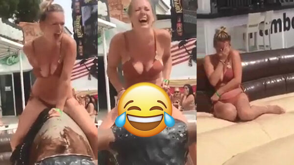 Blondine heeft een bikini malfunction tijdens ritje op mechanische stier