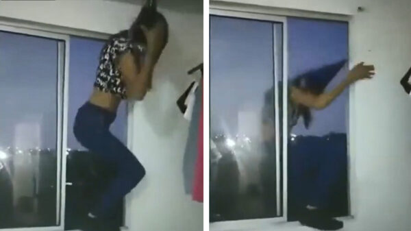 AUW. Feestmuts klettert naar beneden als ze dronken in het raam danst