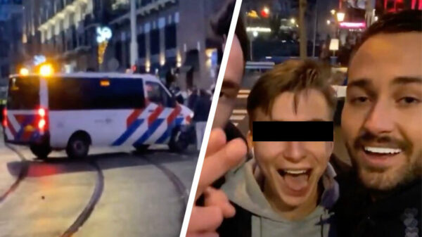 Herres-reporter Dave Roelvink krijgt een knuppel in z’n nek van de ME op het Museumplein