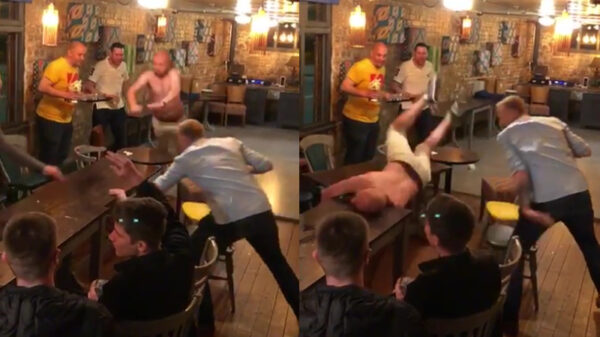 Grapjas breekt bijna nek van buikschuiver door tafel weg te duwen