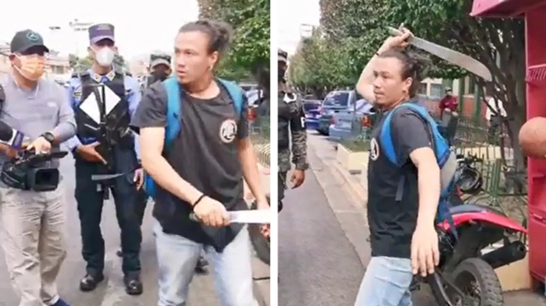 Geen goed idee: zwaaien met een machete naar een verslaggever waar de politie bijstaat