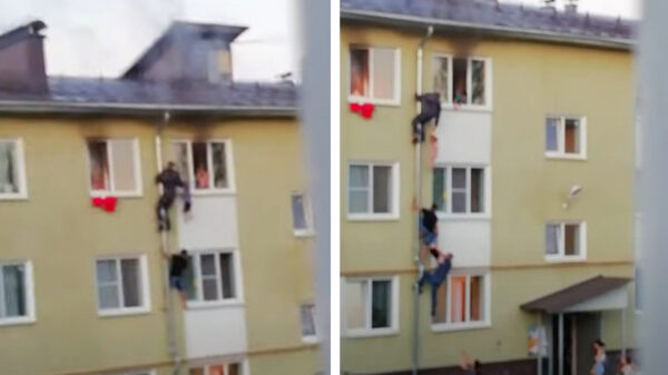 Heldhaftige Russen weten via een regenpijp kinderen te redden van brand