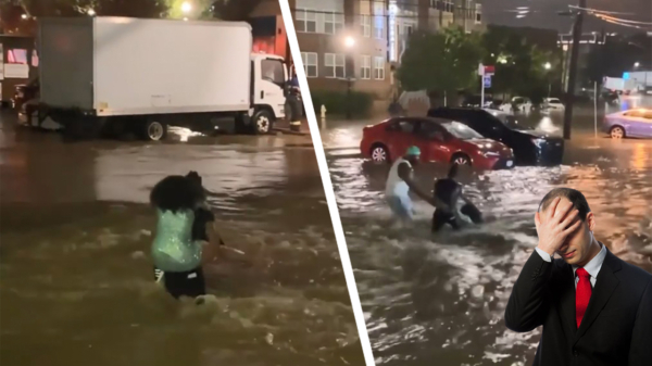 Kerel probeert na overstroming zijn vriendin droog naar de overkant te brengen