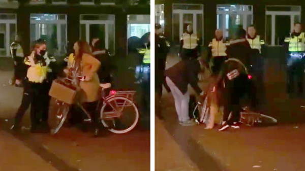 Politieagent duwt vrouw van de fiets tijdens rellen in Leeuwarden