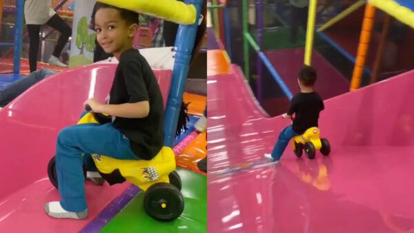 Zet 'm op jongen, ga lekker met je driewieler van de glijbaan!