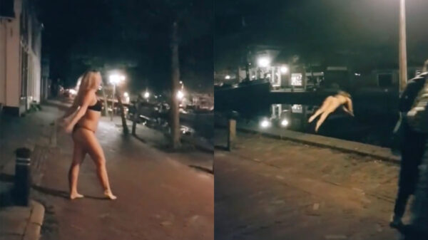 Toch nog een nieuwjaarsduik: Robin duikt in Meppel gewoon het ijskoude water in