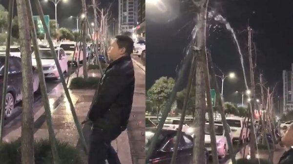 Chinees met hoge nood pronkt even met zijn hogedrukspuitje