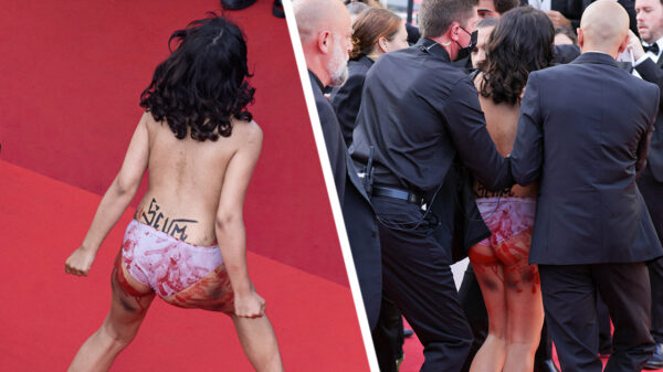 Activiste bestormt rode loper van het Cannes Film Festival met boodschap tegen seksueel geweld in Oekraïne