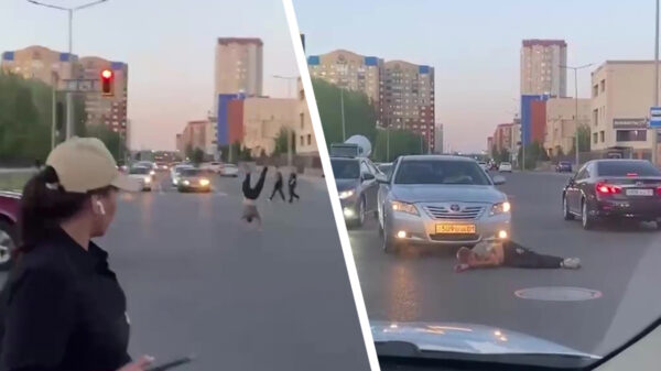 Dronken gymnast krijgt op een druk kruispunt een autospiegel tegen zijn giechel