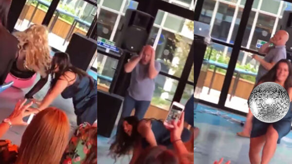 Dansende secretaresse is misschien net iets té uitbundig tijdens bedrijfsfeestje