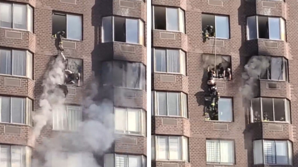 Brandweer New York redt vrouw die uit raam van brandend flatgebouw bungelt