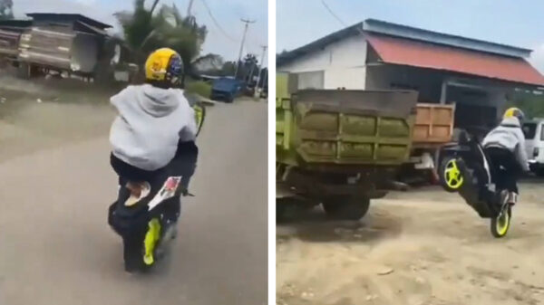 Wheelie door het verkeer eindigt met een salto in de sloot