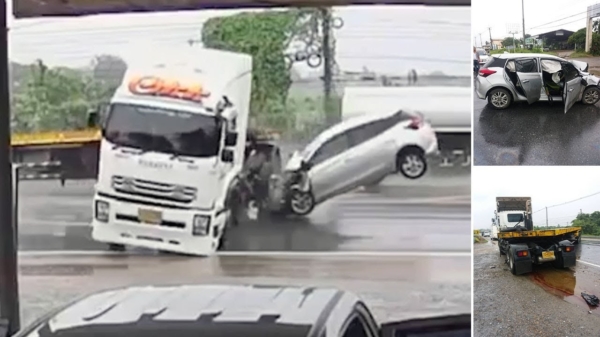 Thaise automobilist klapt hard op glibberende vrachtwagen door nat wegdek
