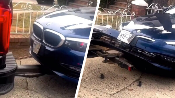 Het slepen van de peperdure BMW verliep niet al te voorspoedig