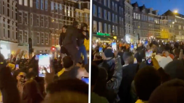 Chaos in de Albert Cuypstraat tijden Koningsdag: auto van gemeente vernield door "feestvierders"