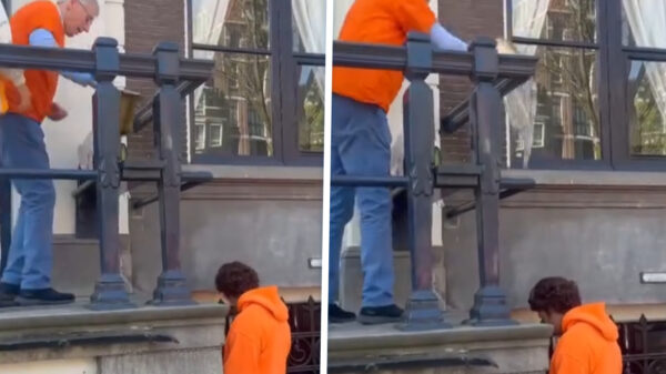 Man speelt geen spelletjes en trakteert zatte stoepsproeier op een nat Oranje-kostuum