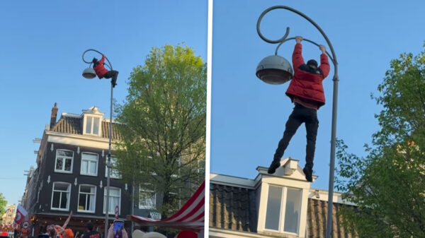 Man neemt uitdrukking 'in de lampen hangen' iets te serieus en geeft Amsterdam 'n spectaculaire show