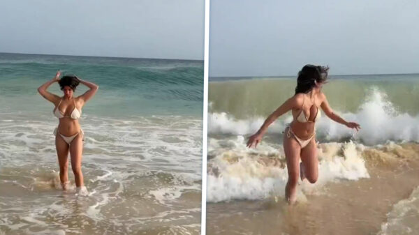 Strandgangster gevloerd door vloedgolf tijdens haar "influencer-momentje"