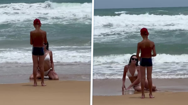 Koter wordt ingeschakeld om mama te helpen met de perfecte vakantiefoto te maken