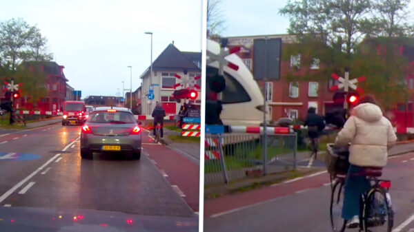 Fietsster glipt nét voor aanstormende trein over het spoor in Winterswijk