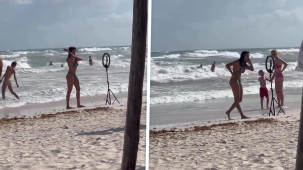 Influencer danst op 't strand terwijl voorbijgangers verbaasd toekijken