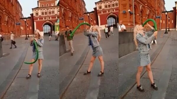 Blonde straatartiest laat zien hoe ze een ballon kan laten verdwijnen