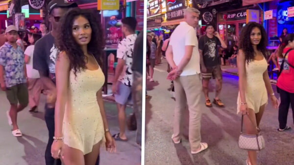 Thaise schone wandelt over straat en legt vast hoeveel kerels haar lastigvallen