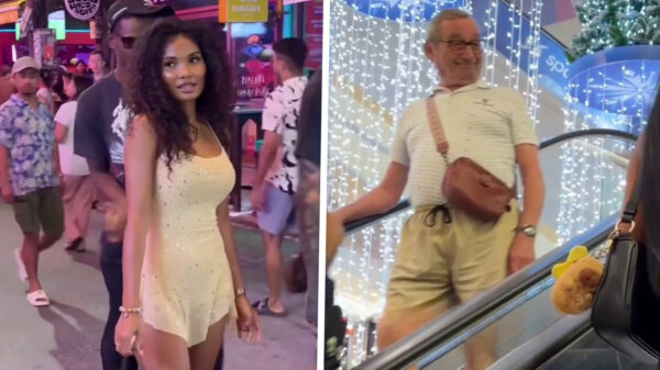 Thaise schone wandelt over straat en legt vast hoeveel kerels haar lastigvallen