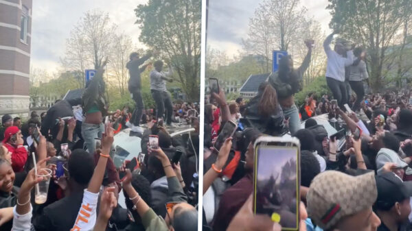 Feestend tuig sloopt auto tijdens Koningsdag in Amsterdam