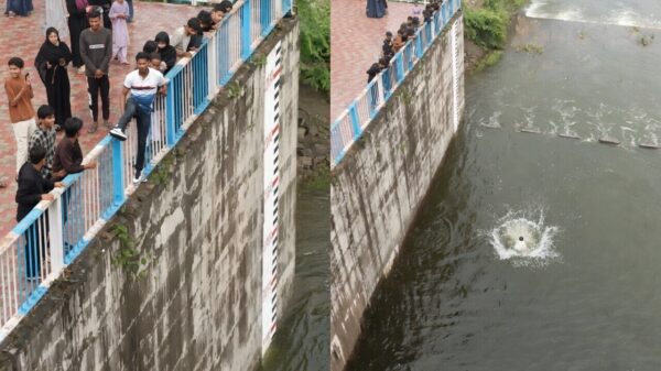 Man springt voor een video van hoge dam en breekt beide benen in ondiep water