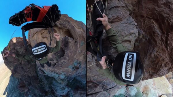 BASE-jumper Johnni DiJulius ziet parachute scheuren en blijft aan klif bungelen