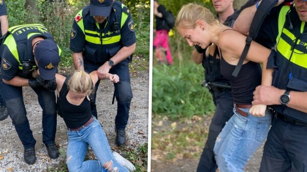 Beelden: Klimaatactivist hardhandig aangepakt door twee politieagenten