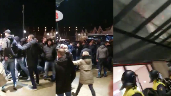 Woedende PSV-supporters bestormen de hoofdingang van het Philips Stadion