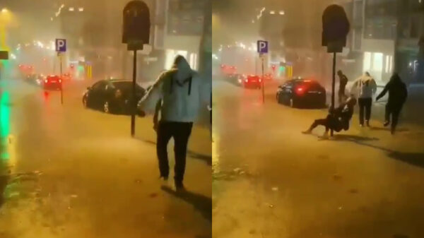 Zanger van de band 'Maraton' kopt een paal tijdens harde regenbui