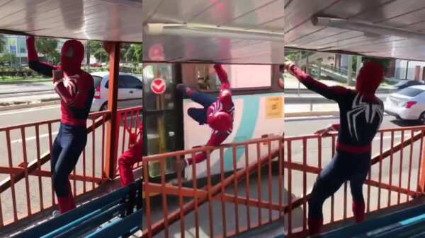 Dansende Spiderman loopt even doodleuk op de zijkant van een bus