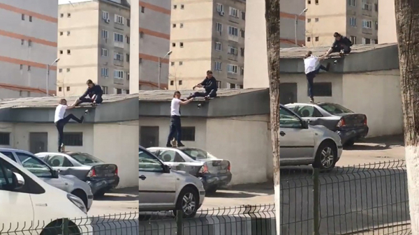 Dronken gabbers kletteren naar beneden als ze op een garage proberen te klimmen