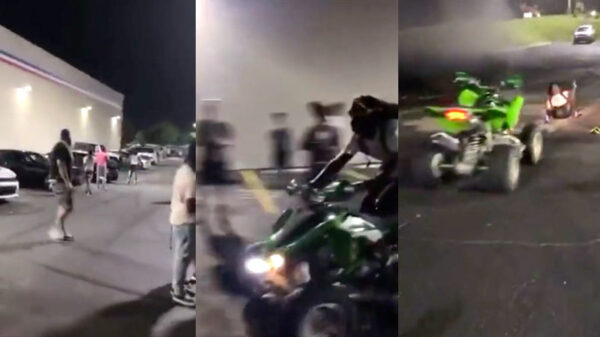 Amateurstuntman op quad maakt wheelie en schept omstander