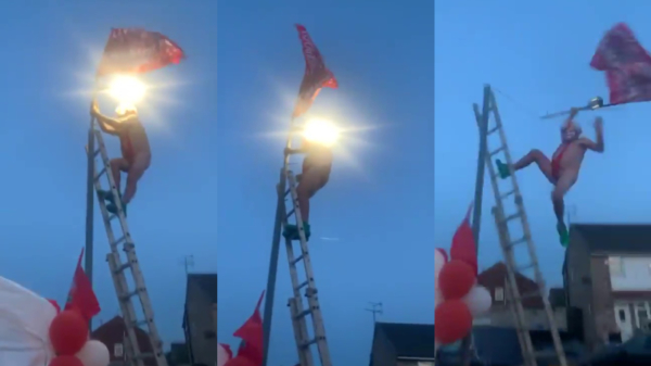 Liverpool-fan feest iets te hard en pleurt uit een vlaggenmast