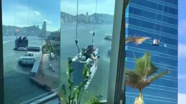 Chinese glazenwassers worden door de wind van links naar rechts geslingerd